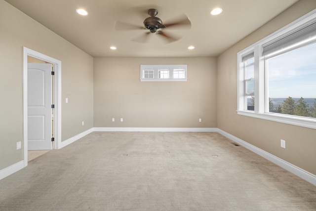 unfurnished room featuring baseboards, light colored carpet, a ceiling fan, and recessed lighting