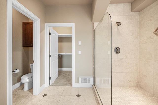 full bath with visible vents, toilet, tile patterned flooring, baseboards, and walk in shower