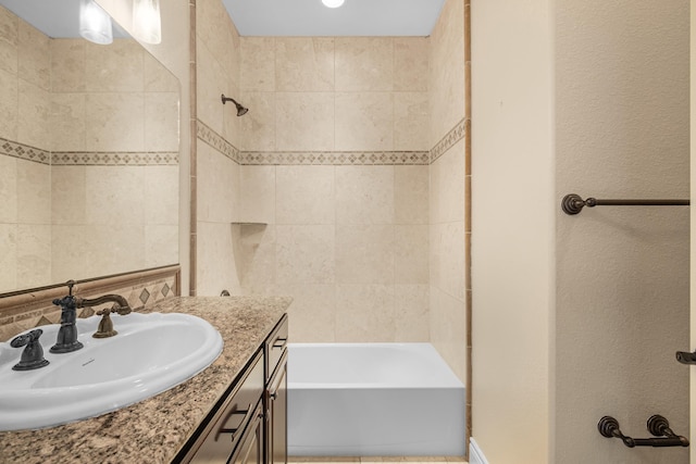 bathroom featuring vanity and shower / bathtub combination