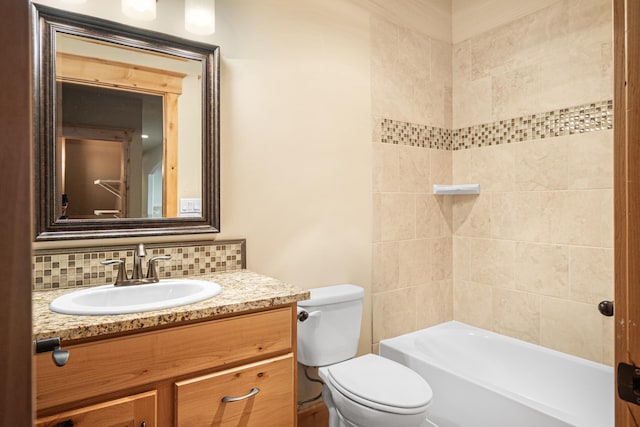 full bath with vanity, decorative backsplash, toilet, and shower / washtub combination