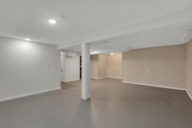 finished below grade area featuring recessed lighting, stairway, and baseboards