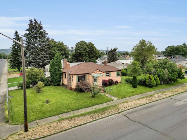 view of front of home with a front yard