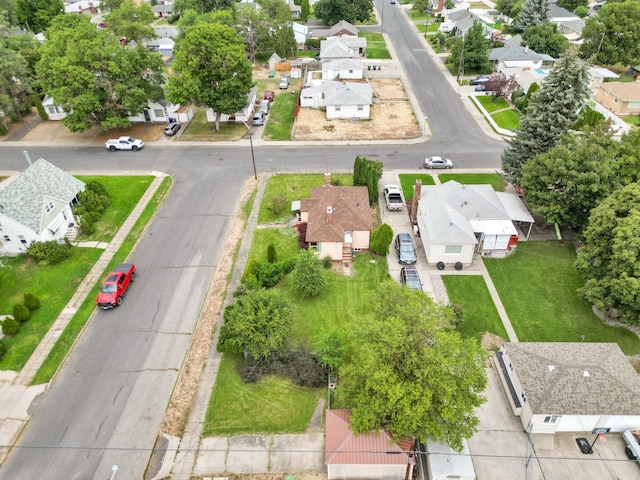 birds eye view of property with a residential view