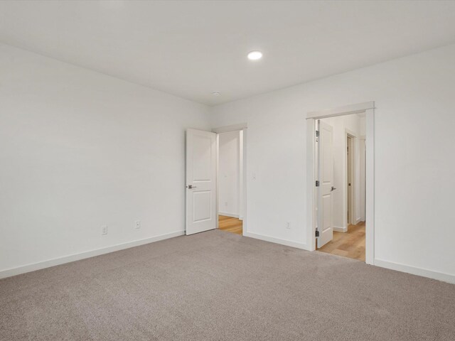 bathroom featuring recessed lighting, vanity, and baseboards