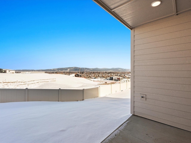 view of yard featuring fence and a mountain view