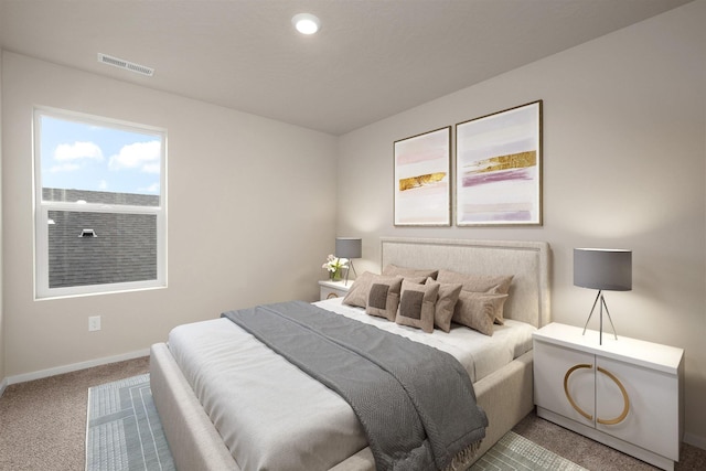 bedroom with carpet floors, baseboards, and visible vents