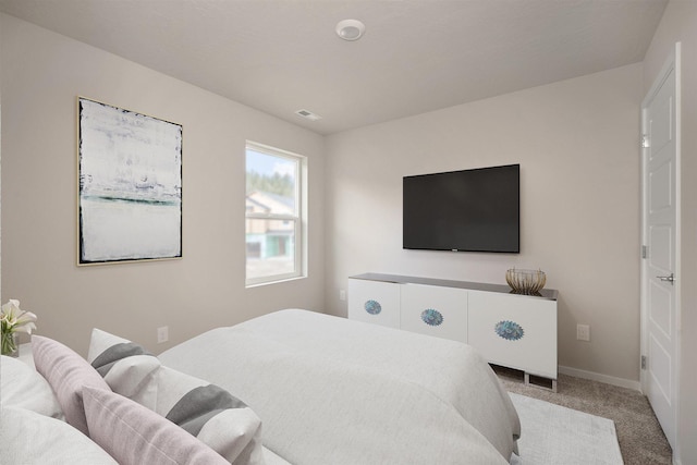 bedroom featuring carpet, visible vents, and baseboards