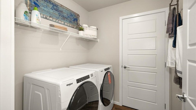 clothes washing area with washing machine and dryer and laundry area