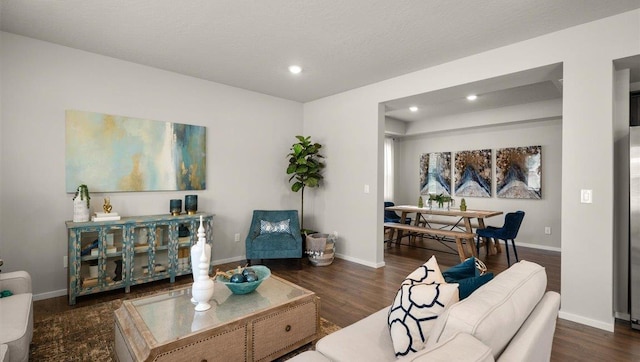 living area featuring recessed lighting, wood finished floors, and baseboards