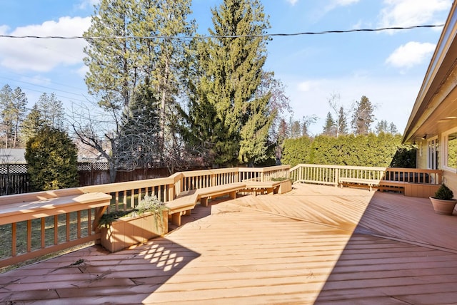 wooden deck featuring fence