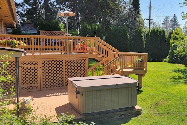 deck featuring a yard and a hot tub