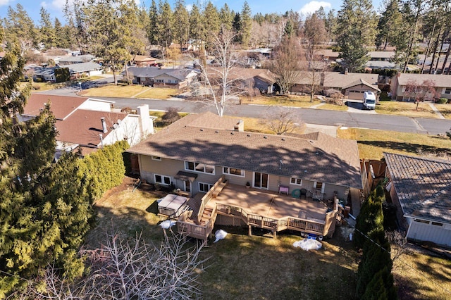 birds eye view of property with a residential view