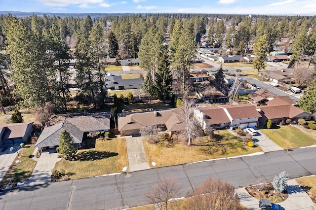 aerial view with a residential view and a wooded view