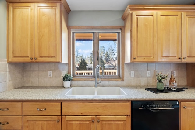 kitchen with a sink, light countertops, and dishwasher