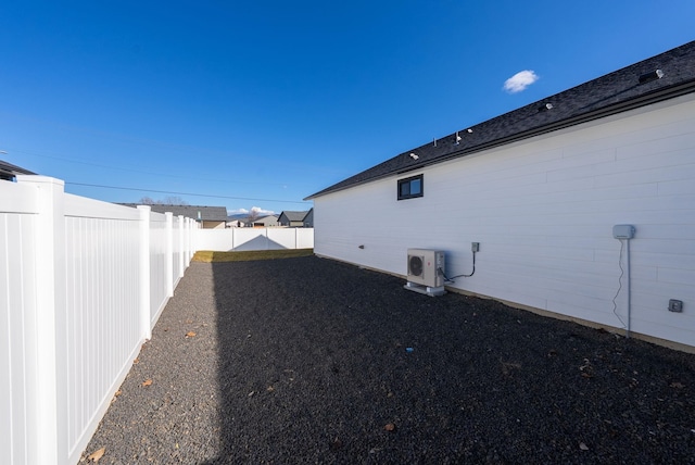 view of home's exterior with ac unit and a fenced backyard