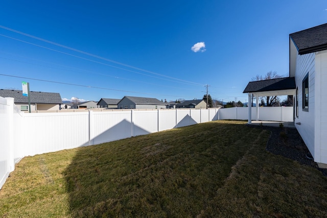 view of yard featuring a fenced backyard