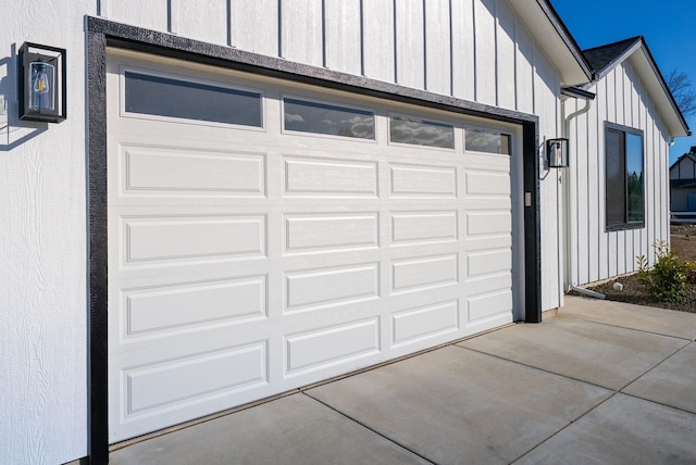 garage featuring concrete driveway