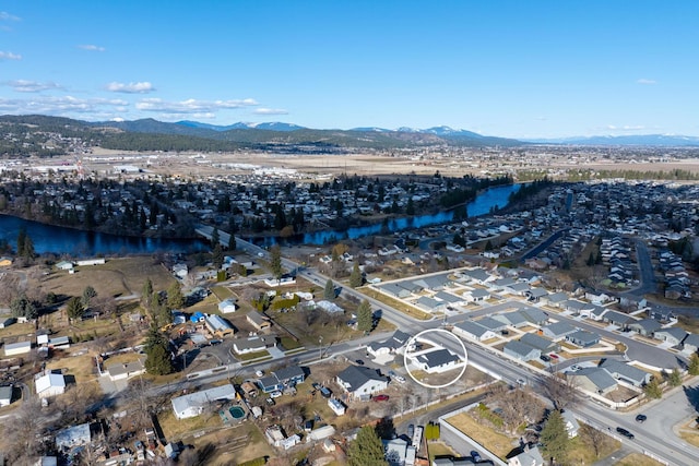 bird's eye view featuring a water and mountain view