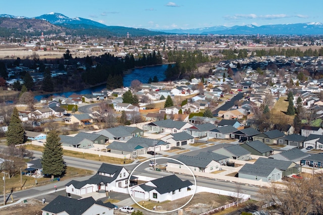 drone / aerial view with a residential view and a mountain view