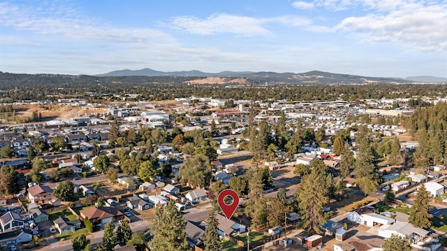 drone / aerial view with a residential view and a mountain view