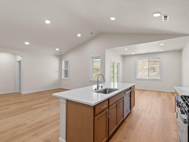1624 S Moen St Unit 3/1Orchard, Spokane Valley, WA 99016 - kitchen with appliances with stainless steel finishes, light wood-type flooring, an island with sink, open floor plan, and lofted ceiling