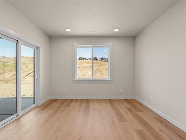 1624 S Moen St Unit 3/1Orchard, Spokane Valley, WA 99016 - empty room featuring light wood-type flooring and recessed lighting