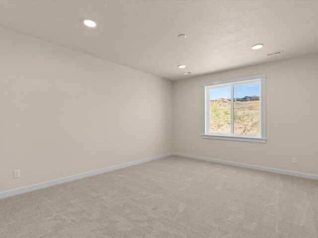 1624 S Moen St Unit 3/1Orchard, Spokane Valley, WA 99016 - empty room featuring light colored carpet and recessed lighting