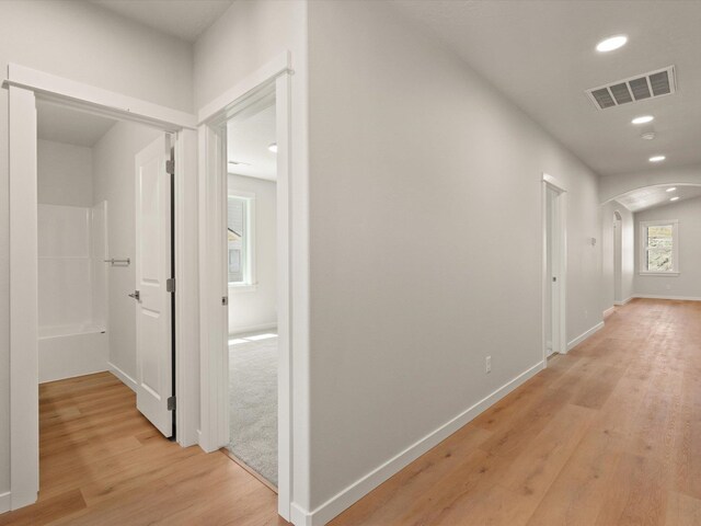 1624 S Moen St Unit 3/1Orchard, Spokane Valley, WA 99016 - hall with arched walkways, light wood finished floors, and recessed lighting