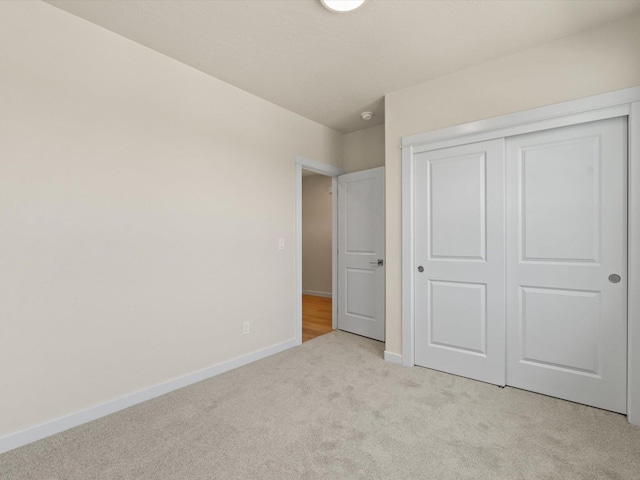 1624 S Moen St Unit 3/1Orchard, Spokane Valley, WA 99016 - unfurnished bedroom featuring light carpet and a closet