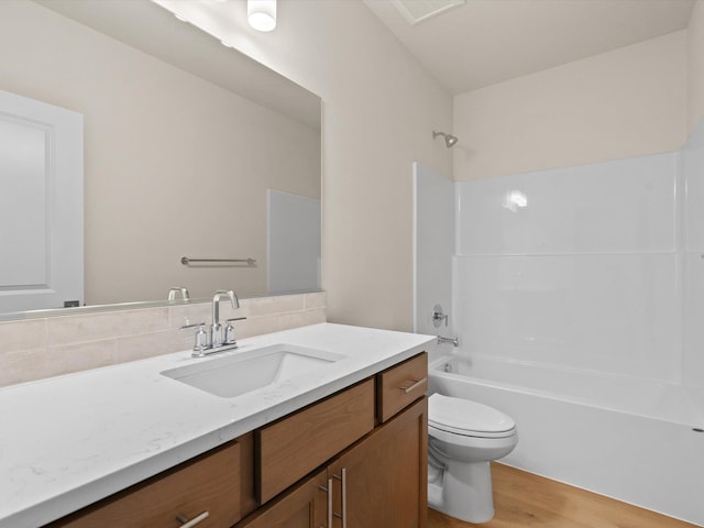 1624 S Moen St Unit 3/1Orchard, Spokane Valley, WA 99016 - bathroom with vanity, wood finished floors, shower / washtub combination, and backsplash