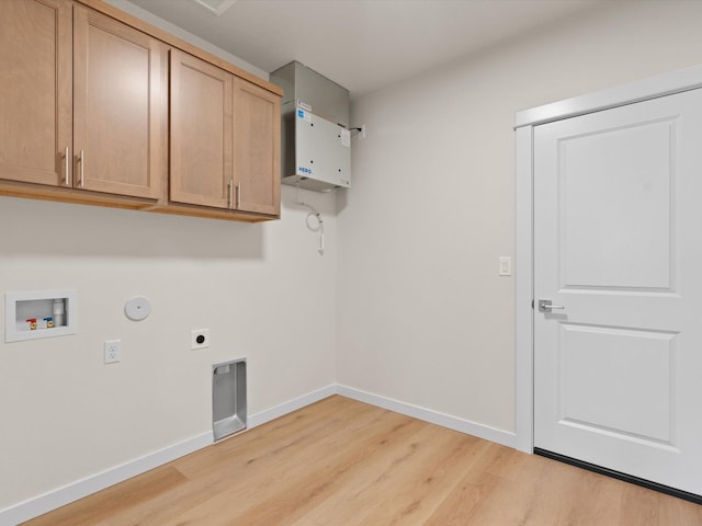 1624 S Moen St Unit 3/1Orchard, Spokane Valley, WA 99016 - laundry room featuring light wood-style floors, cabinet space, hookup for a washing machine, hookup for an electric dryer, and hookup for a gas dryer