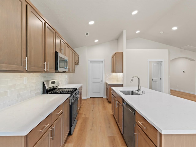 1624 S Moen St Unit 3/1Orchard, Spokane Valley, WA 99016 - kitchen featuring appliances with stainless steel finishes, lofted ceiling, light wood-type flooring, tasteful backsplash, and recessed lighting