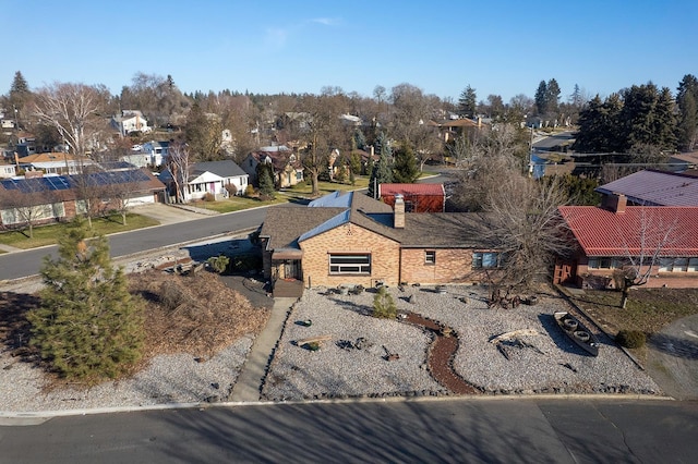 birds eye view of property with a residential view