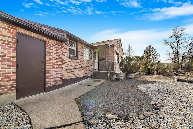 view of home's exterior featuring brick siding