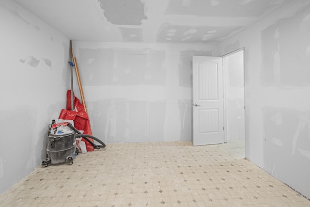 unfurnished room with tile patterned floors