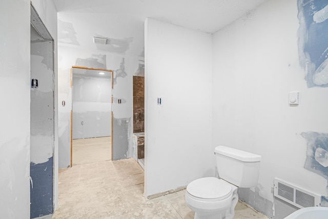 bathroom featuring toilet and visible vents