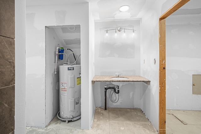 utilities featuring water heater and a sink