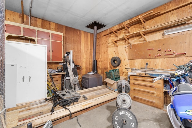 interior space featuring wood walls and a workshop area