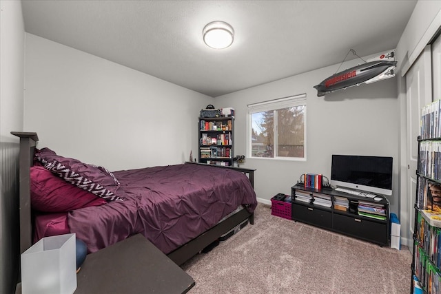 carpeted bedroom with baseboards