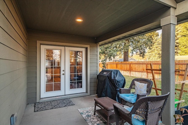 view of patio / terrace with fence, area for grilling, and french doors