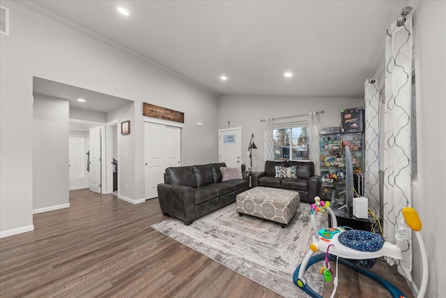 living area with lofted ceiling, recessed lighting, visible vents, wood finished floors, and baseboards