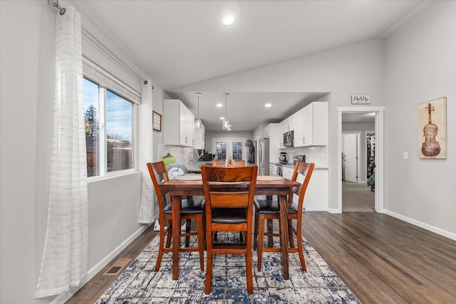 dining area featuring baseboards, vaulted ceiling, dark wood-type flooring, and recessed lighting