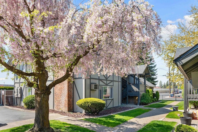 102 E Weile Ave # 3, Spokane, WA 99208 - exterior space with an AC wall unit, stucco siding, and fence