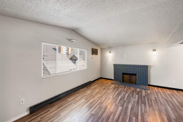 102 E Weile Ave # 3, Spokane, WA 99208 - unfurnished living room featuring baseboards, wood finished floors, a textured ceiling, and vaulted ceiling