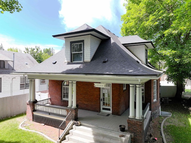 2508 S Grand Blvd, Spokane, WA 99203 - view of front of home with a porch, a shingled roof, and brick siding