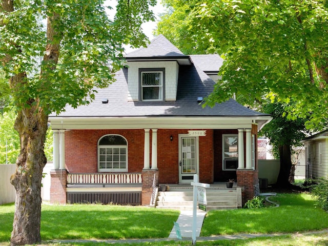 2508 S Grand Blvd, Spokane, WA 99203 - view of front of home featuring covered porch, a front lawn, and a shingled roof