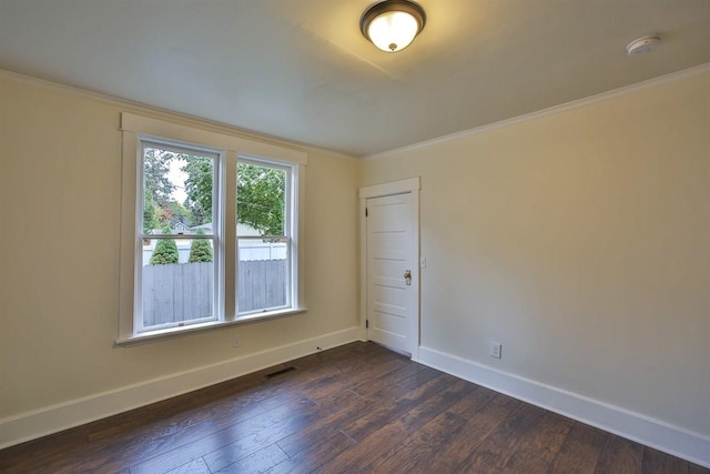 2508 S Grand Blvd, Spokane, WA 99203 - spare room with a smoke detector, dark wood-style floors, baseboards, and ornamental molding