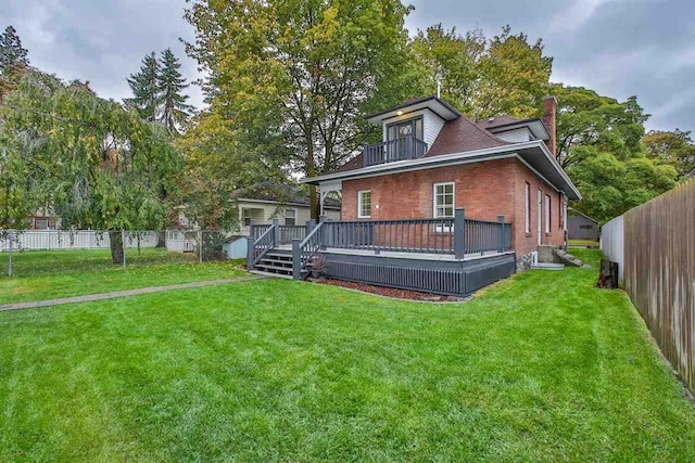 2508 S Grand Blvd, Spokane, WA 99203 - back of property featuring a balcony, a chimney, brick siding, and a wooden deck