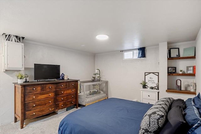 bedroom featuring light carpet