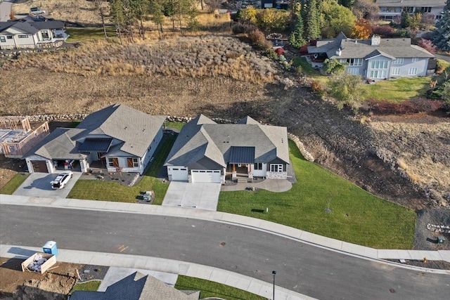 birds eye view of property with a residential view